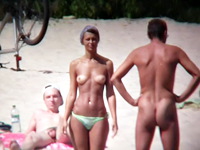 This is the crowded beach on which the real nudists are lying in every possible position letting us enjoy their sexy slits